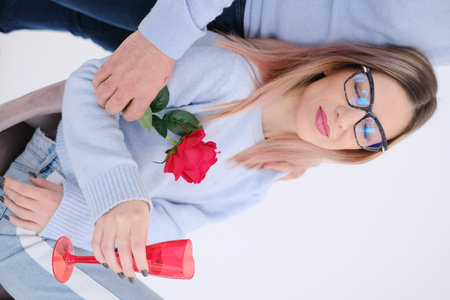 Young beautiful woman leaning on her man. Love concept. Love celebration.の写真素材