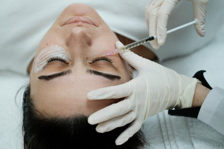 Top view of female patient having eye mesotheraphy appliedの写真素材