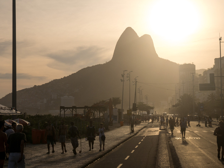RIO DE JANEIRO, BRAZIL - OCTOBER 24, 2016:  People enjoy the Ipanema Beach at Sunset in Rio de Janeiroのeditorial素材