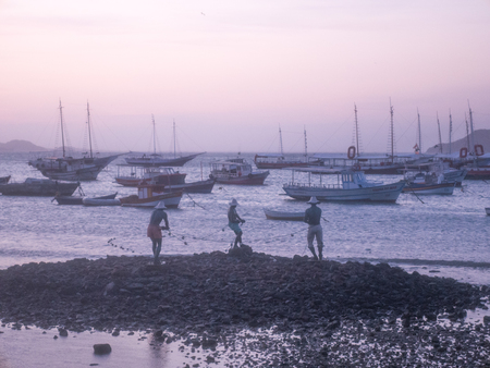 BUZIOS, BRAZIL - OCTOBER 24: Fisher Men monument at Sunset in Buzios. Rio de Janeiro, Brazilのeditorial素材