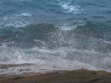 Waves Splashes on the rocksの写真素材
