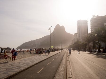 RIO DE JANEIRO, BRAZIL - OCTOBER 24, 2016:  People enjoy the Ipanema Beach at Sunset in Rio de Janeiroのeditorial素材