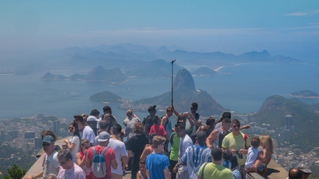 Rio de Janeiro, Brazil - September 18, 2016:  Tourists take selfie photo at the Christ the Redeemer statue atop the Corcovado Mountain in Rio de Janeiro, Brazil.のeditorial素材