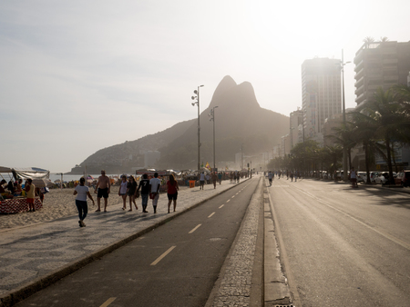 RIO DE JANEIRO, BRAZIL - OCTOBER 24, 2016:  People enjoy the Ipanema Beach at Sunset in Rio de Janeiroのeditorial素材