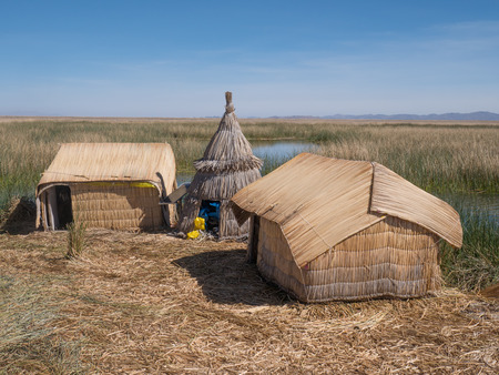 View of the Uros floating reed islands with boats, mysterious Lake Titicaca, Puno Region, Peruの写真素材