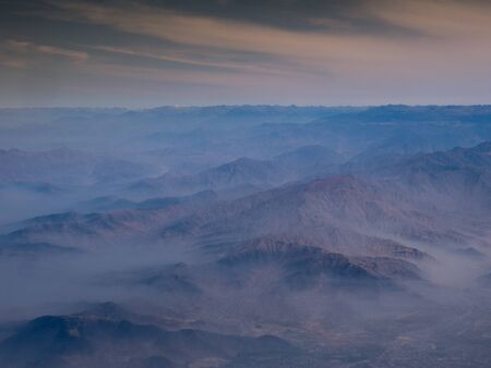 Aerial view from window plane of Andes mountainsの写真素材