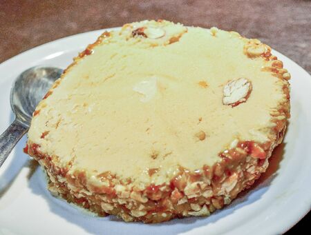 Almond ice cream on a plateの写真素材