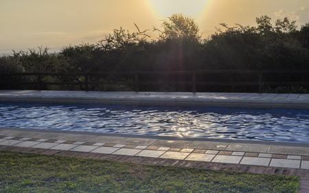 swimming pool in sunriseの写真素材