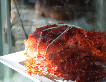 seafood, centolla Displayed in the window of a restaurantの写真素材