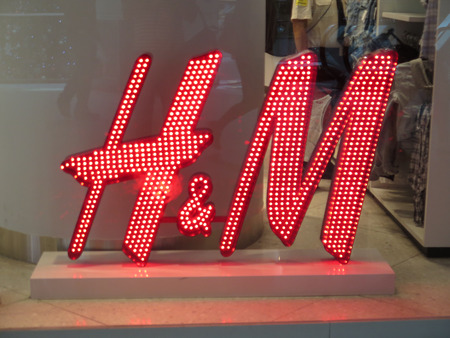 SANTIAGO DE CHILE, CHILE - NOVEMBER 24, 2016:  close up shot of H&M logo. H & M Hennes & Mauritz AB is a Swedish multinational retail-clothing company, known for its fast-fashion clothingのeditorial素材