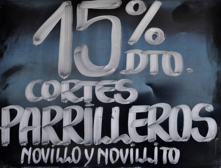 CORDOBA, ARGENTINA - JANUARY 10, 2016: A letter that reads in spanish 15% discount in meat in Villa General Belgrano, Cordoba, Argentina. Inflation in Argentina is estimated at 18% by 2017のeditorial素材