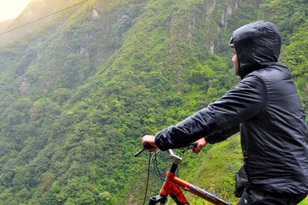 Man riding bicycle at Banos, Ecuadorの写真素材