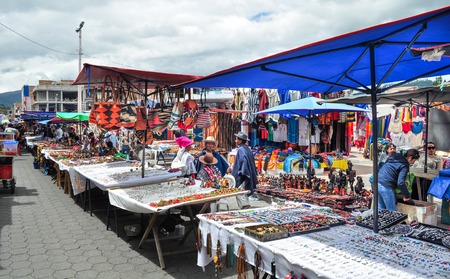 OTAVALO, ECUADOR - MARCH 23, 2016: Colorful textile stall in the popular Otavalo marketのeditorial素材
