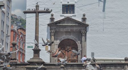 QUITO, ECUADOR - MARCH 25, 2016: Pigeons in the entrance of San Francisco Church in Quito, Ecuadorのeditorial素材