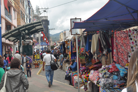 OTAVALO, ECUADOR - MARCH 23, 2016: Colorful textile stall in the popular Otavalo marketのeditorial素材
