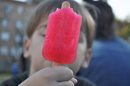 little boy showing ice creamの写真素材