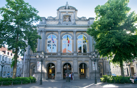 BRUGES, BELGIUM - MAY 26, 2017: The facade of the City Theatre with the statue of Papageno, the character of Mozart's opera The Magic Fluteのeditorial素材