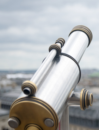 antique telescope with view over Paris, France, at duskの写真素材