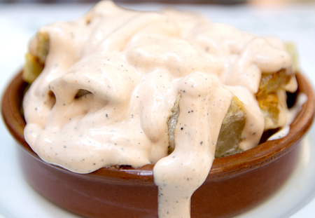 Bravas dip, Traditional Spanish baked potato with hot pepper chili sauceの写真素材