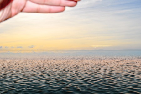 Man staring at the sea skylineの写真素材