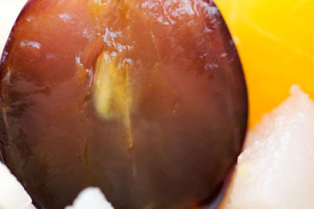 Fresh and healthy tropical fruit salad with half red grapeの写真素材