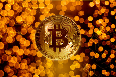 Gold bitcoin coin against blur lights backgroundの写真素材
