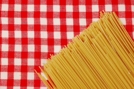 Raw Noodles over Red Tableclothの写真素材