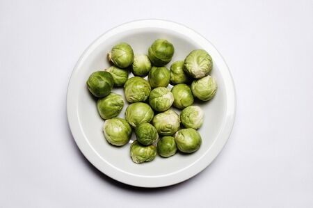 Brussel Sprouts on Plate on white background 
の写真素材