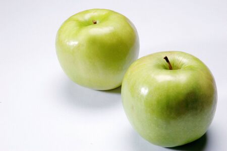 Green Apples, Close Up against white backgroundの写真素材