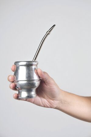 Hand with Yerba Mate on white backgroundの写真素材