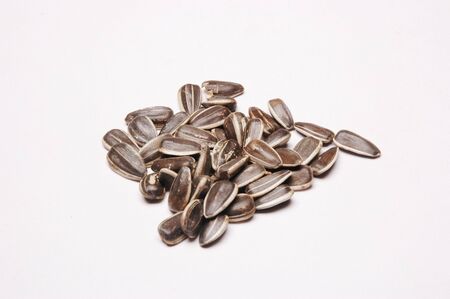 Sunflower Seeds, Close Up against white backgroundの写真素材