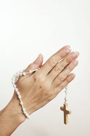 Hand with Rosary on white backgroundの写真素材