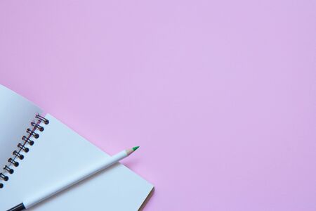 Set of stationery items on pink background. Flat lay