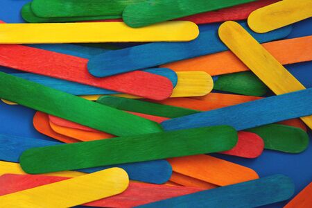 Colorful Ice Cream Stick. Abstract wooden sticks background. Colorful rainbow wooden popsiclesの写真素材