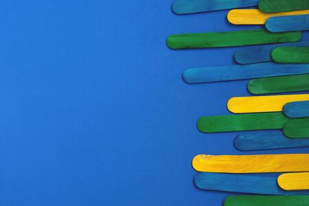Colorful Ice Cream Stick. Abstract wooden sticks background. Colorful rainbow wooden popsiclesの写真素材
