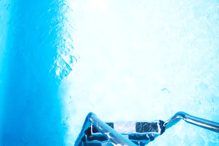Blue ripped water in swimming pool. Clear and blue, clear water in the pool. Surface of blue...