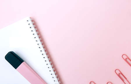 School stationery and supplies on a pink background with space for caption. Back to school, homeschool creative workspace. Minimalistic set of colorful stationery. Flat layの写真素材