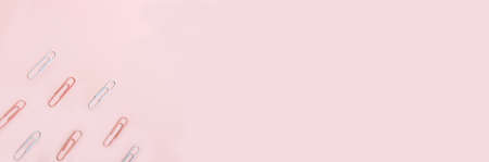 School stationery and supplies on a pink background with space for caption. Back to school, homeschool creative workspace. Minimalistic set of colorful stationery. Flat layの写真素材