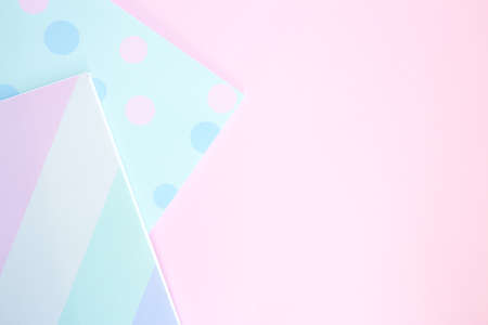 Two bright sketchbooks on a pink background. Stationery on a pink background with space for text. Back to school, creative workspace. Flat layの写真素材