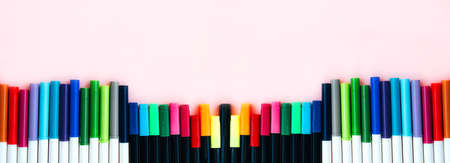 Colorful marker pen set on light pink background. Vivid highlighters and blank space for your design or montage. Background   Flat layの写真素材