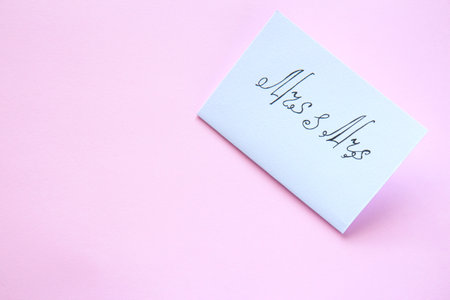 White card with the inscription Mrs and Mrs on a pink background. Sweets macarons on a bright background. Lesbian weddingの写真素材