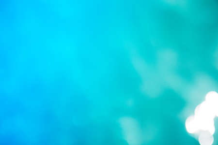 Blurred surface of blue water. Background of blue ripped water in swimming pool. Neon backgroundの写真素材