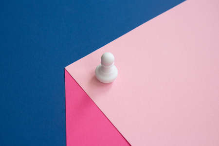 Abstract background. White chess piece on a cube. Pawn on a bright background. Colorful chess...
