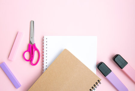 School stationery and supplies on pink background with space for text. Back to school, online...