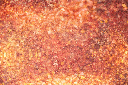 Bright golden abstract festive background with sparkles and bokeh. Christmas and New year holidays background. Festive conceptの写真素材