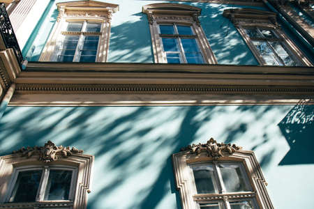 Classic vintage building facade. Elements of the architecture decorations of an old building....