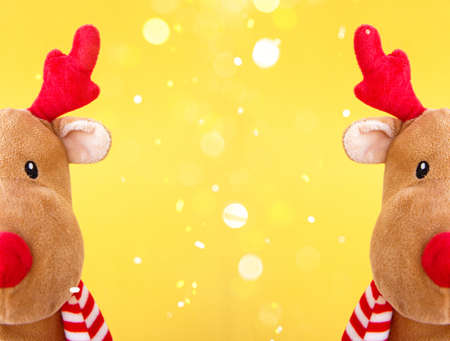 Christmas deer on a golden background with blur. Merry Christmas and Happy Holidays greeting card. New Year. Deer head close-upの写真素材