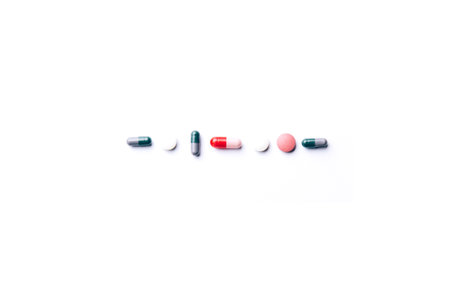 Dietary supplements and pills for dieting. Vitamin tablets on a white background. Medical concept. Seen from above. Flat layの写真素材