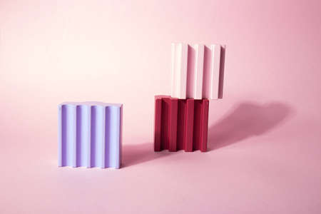 Geometric shapes podium for product display. Multicolored architecture of glossy abstract shapes on...