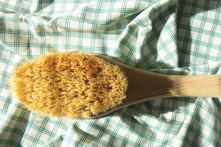 Dry natural bristle brush with wooden handle for anti cellulite massageの写真素材